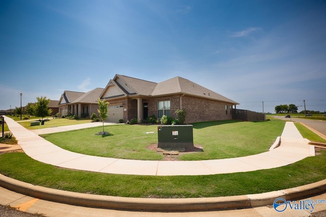 14614 Demarie Ln, Athens, AL 35613 - view of front of property with brick siding, a front yard, a garage, and concrete driveway
