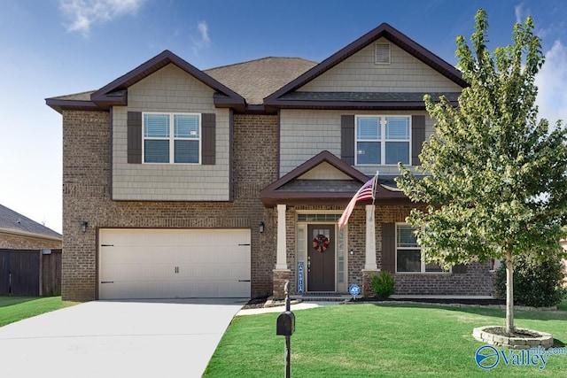 craftsman-style house with a garage, brick siding, concrete driveway, and a front yard