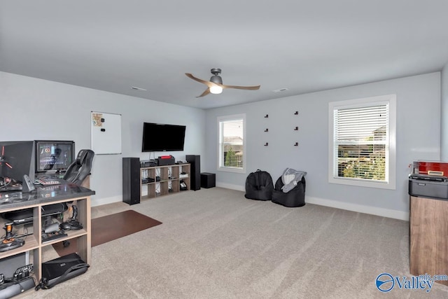 interior space featuring ceiling fan and baseboards