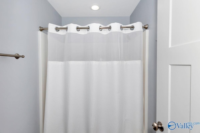 bathroom with a shower with curtain