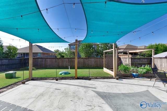 view of patio featuring a fenced backyard and a garden