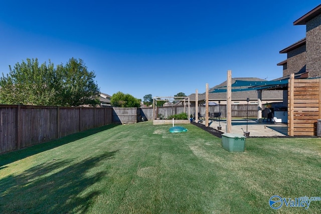 view of yard featuring a fenced backyard, a pergola, and a patio