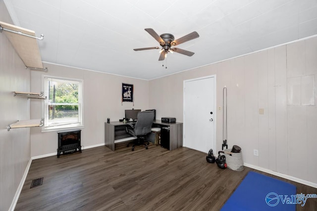 office featuring baseboards, wood finished floors, visible vents, and ceiling fan