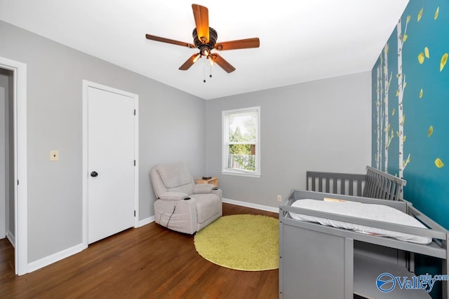bedroom with baseboards, dark wood-style floors, and ceiling fan