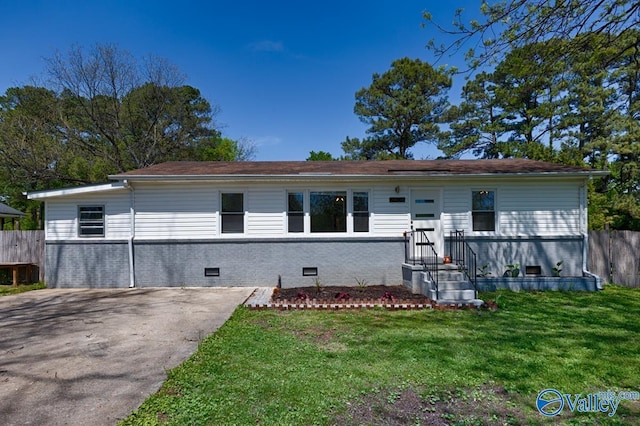 view of front facade with crawl space, a front lawn, and fence