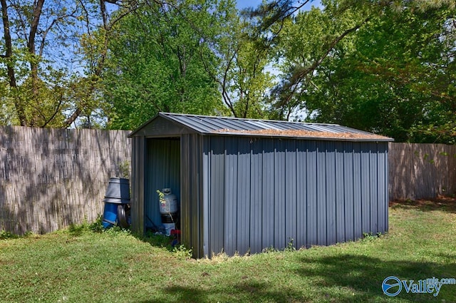 view of shed with a fenced backyard