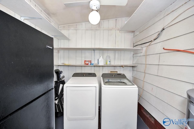 washroom featuring a ceiling fan, washer and dryer, and laundry area