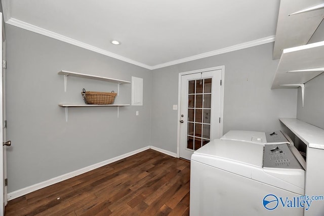 clothes washing area with laundry area, crown molding, dark wood-type flooring, and washer and dryer