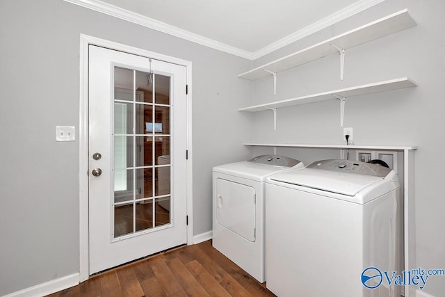 laundry area featuring laundry area, baseboards, dark wood-style flooring, crown molding, and washer and dryer