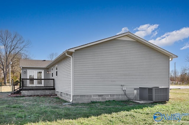 view of home's exterior with crawl space, central AC unit, a lawn, and a wooden deck