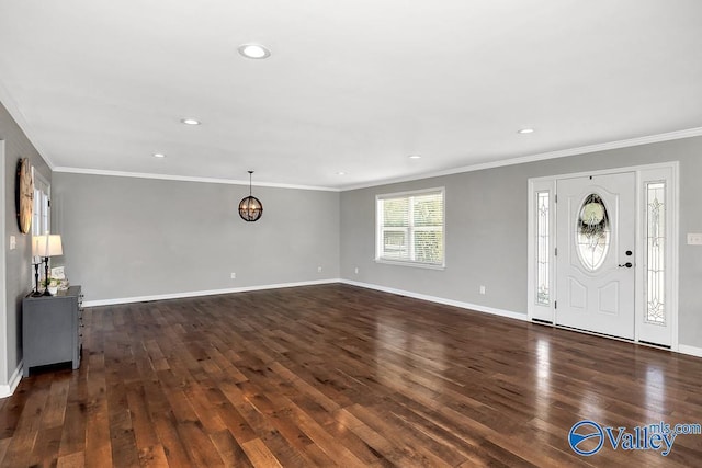 foyer entrance with dark wood-style floors, baseboards, and ornamental molding