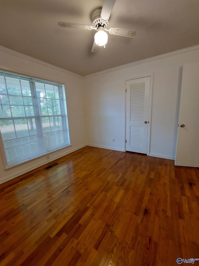 unfurnished room featuring crown molding, ceiling fan, and hardwood / wood-style flooring