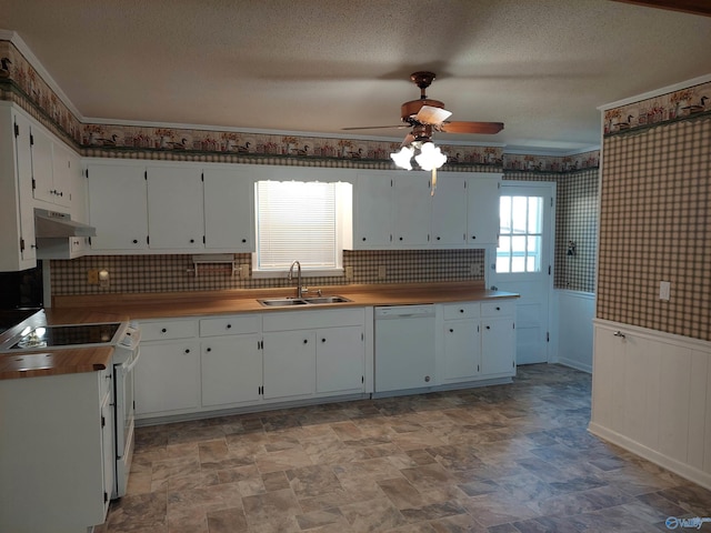 kitchen with sink, white appliances, ceiling fan, a textured ceiling, and white cabinets