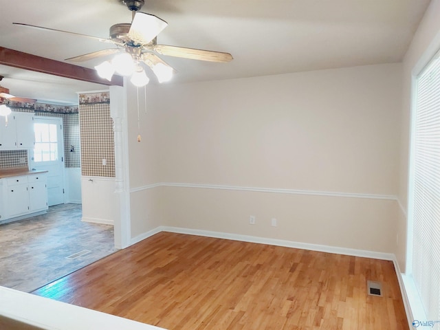 spare room with ceiling fan and light hardwood / wood-style flooring