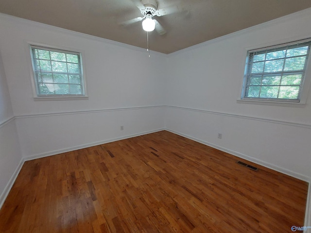 empty room featuring hardwood / wood-style floors and ceiling fan