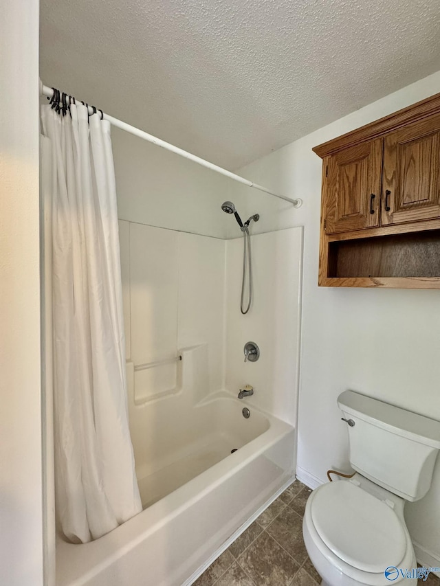 bathroom featuring a textured ceiling, toilet, and shower / tub combo with curtain