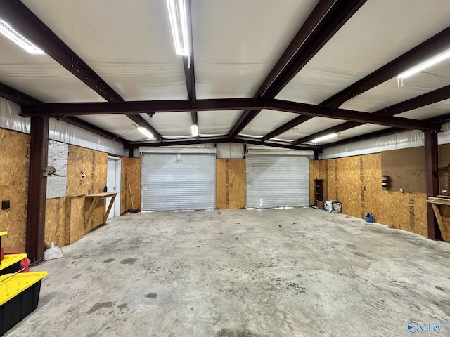 garage featuring wood walls