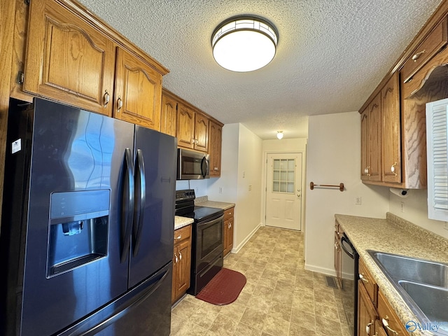 kitchen featuring black appliances and sink