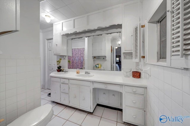 104 Myrtle Pl, Stevenson, AL 35772 - bathroom featuring tile walls, radiator heating unit, vanity, tile patterned floors, and crown molding