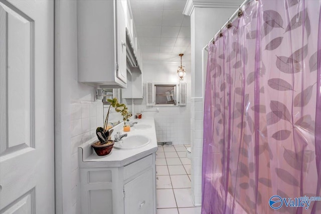 104 Myrtle Pl, Stevenson, AL 35772 - full bathroom with tile walls, double vanity, tile patterned flooring, curtained shower, and a wainscoted wall
