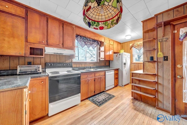 104 Myrtle Pl, Stevenson, AL 35772 - kitchen with white appliances, under cabinet range hood, open shelves, plenty of natural light, and wood walls