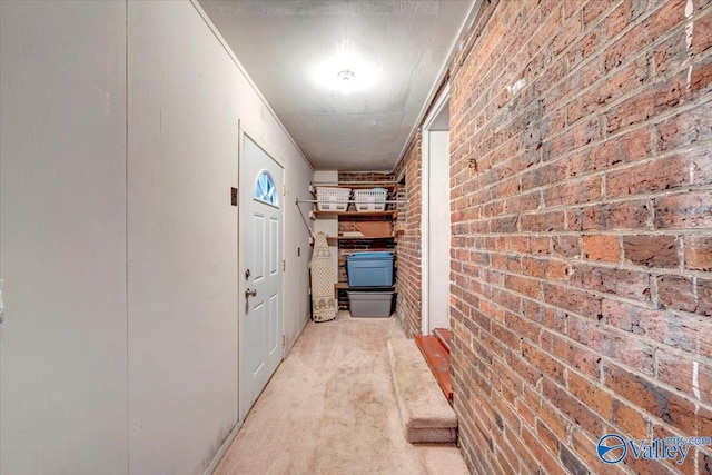 104 Myrtle Pl, Stevenson, AL 35772 - hallway featuring brick wall and light carpet