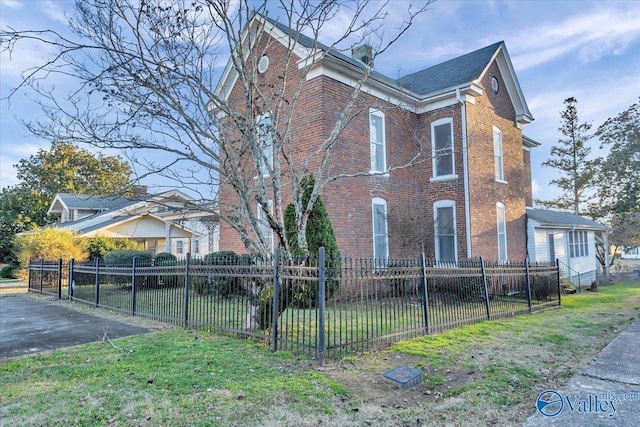 104 Myrtle Pl, Stevenson, AL 35772 - view of home's exterior featuring brick siding and a fenced front yard