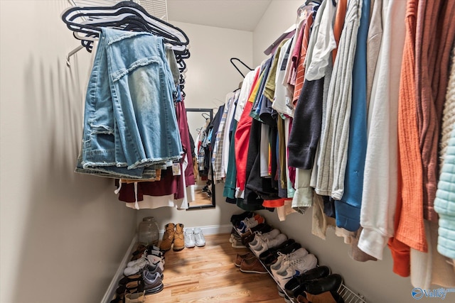 spacious closet featuring hardwood / wood-style floors