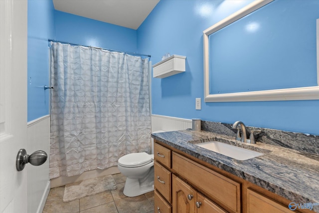 full bathroom with tile patterned flooring, vanity, shower / bath combo, and toilet