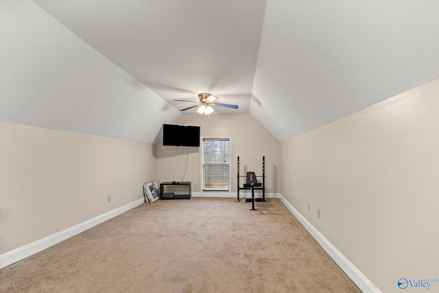 additional living space featuring lofted ceiling, light carpet, and ceiling fan