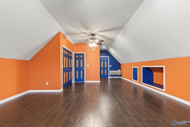 additional living space featuring vaulted ceiling, dark hardwood / wood-style floors, and ceiling fan