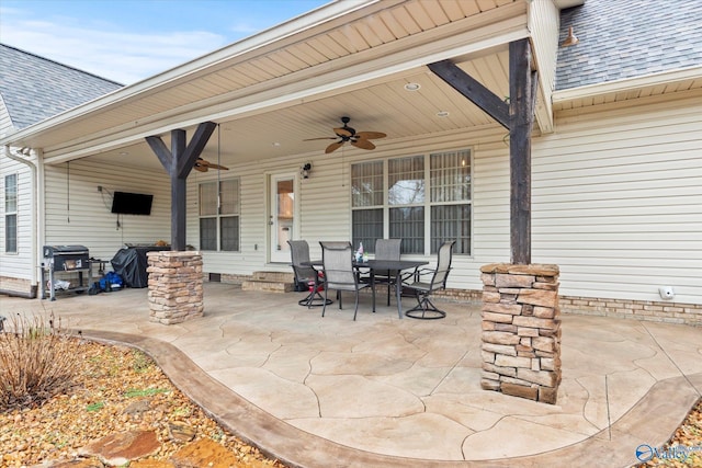 view of patio with area for grilling and ceiling fan