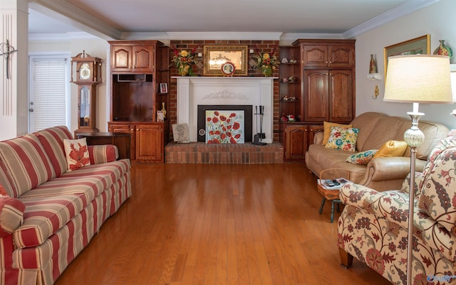 living room featuring a fireplace, light hardwood / wood-style floors, and ornamental molding