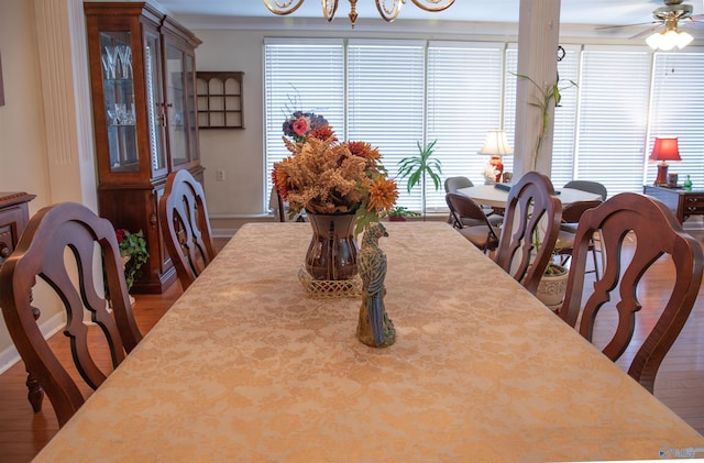 dining space featuring ceiling fan, hardwood / wood-style floors, and ornamental molding