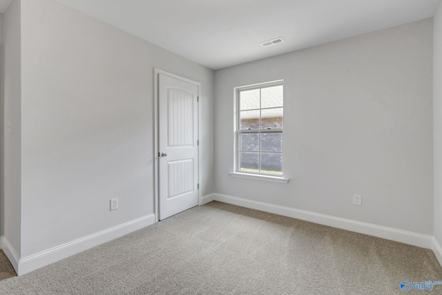 unfurnished room featuring carpet