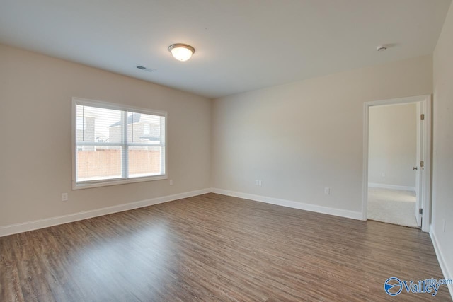 spare room featuring hardwood / wood-style flooring