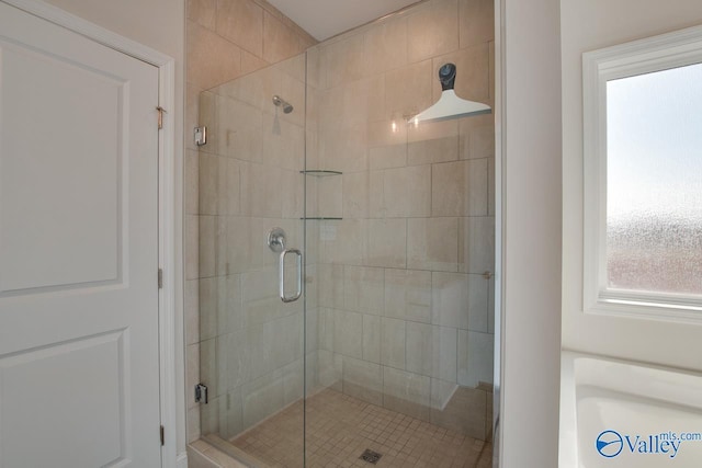 bathroom featuring walk in shower