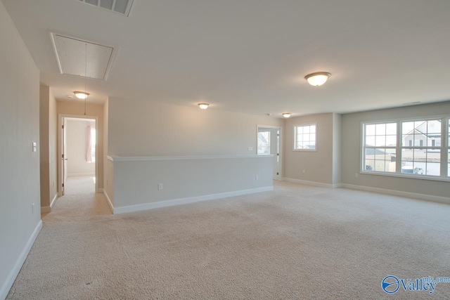 empty room featuring light carpet