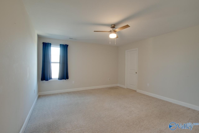 unfurnished room featuring ceiling fan and light colored carpet