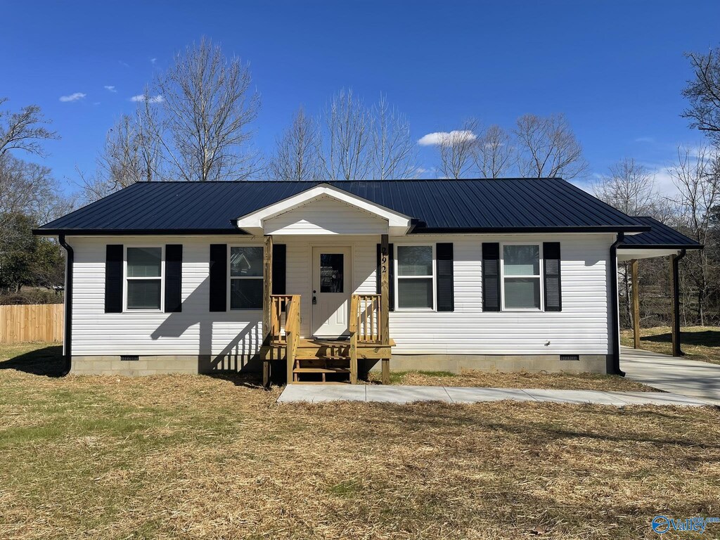221 Maple Ave, Boaz, AL 35957 - view of front of property with metal roof, fence, a front yard, and crawl space
