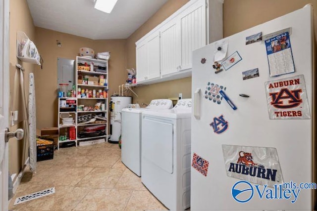 laundry area with light tile patterned flooring, cabinets, electric water heater, and washing machine and clothes dryer