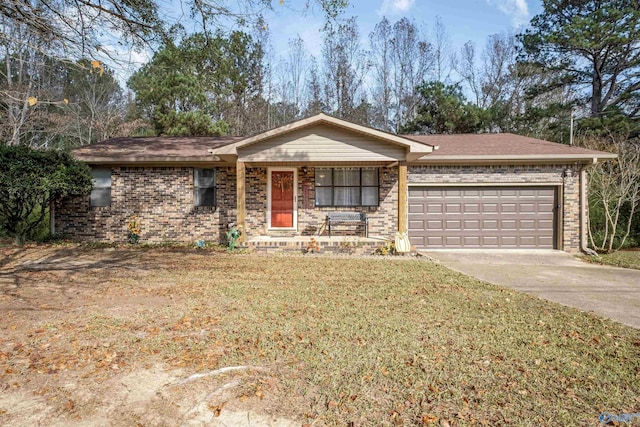 ranch-style house featuring a front yard and a garage