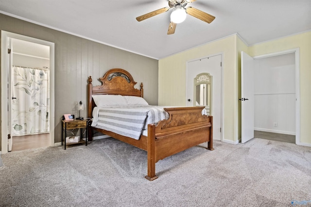 carpeted bedroom featuring ceiling fan and ornamental molding