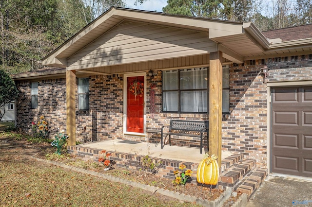 view of front of house with covered porch and a garage