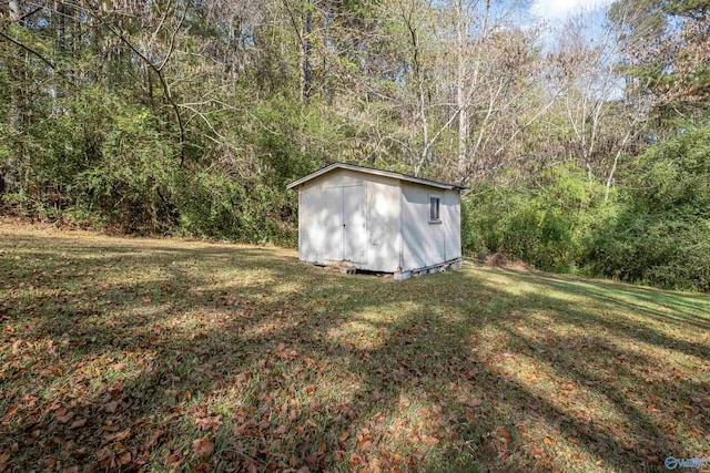 view of outdoor structure with a lawn