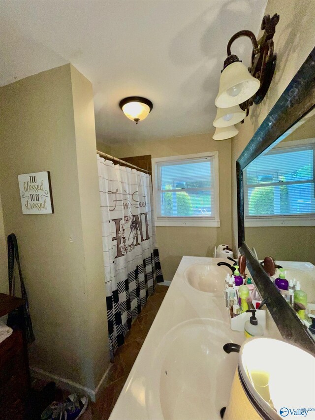 bathroom featuring a shower with curtain, vanity, and tile patterned flooring