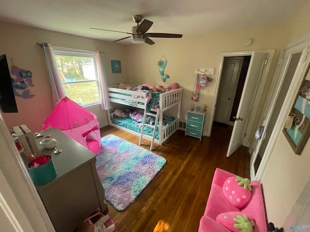 bedroom featuring ceiling fan and dark wood-type flooring