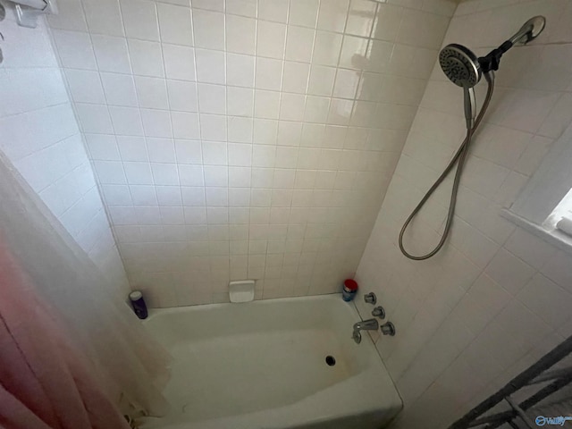 bathroom with shower / bathtub combination with curtain