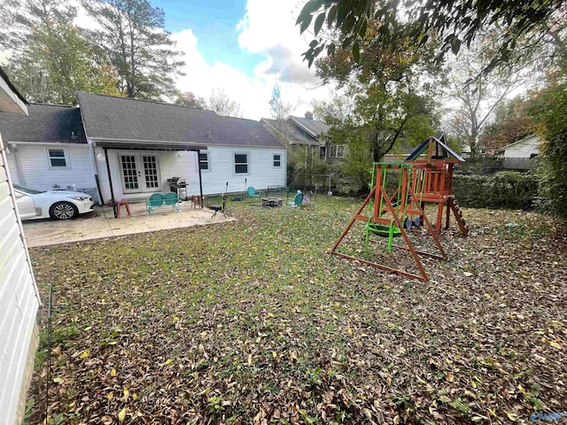 exterior space with a patio area and a lawn