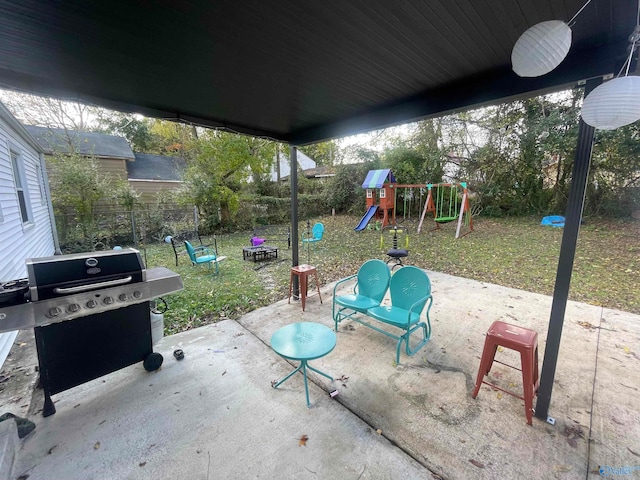 view of patio / terrace featuring a playground and a grill